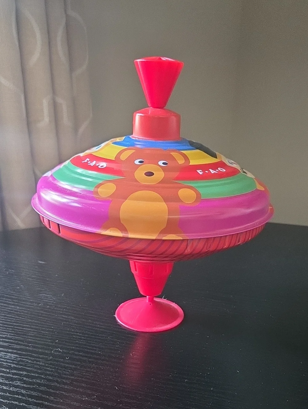 FAO Schwarz Bright Pink Spinning Top with Bear Graphic